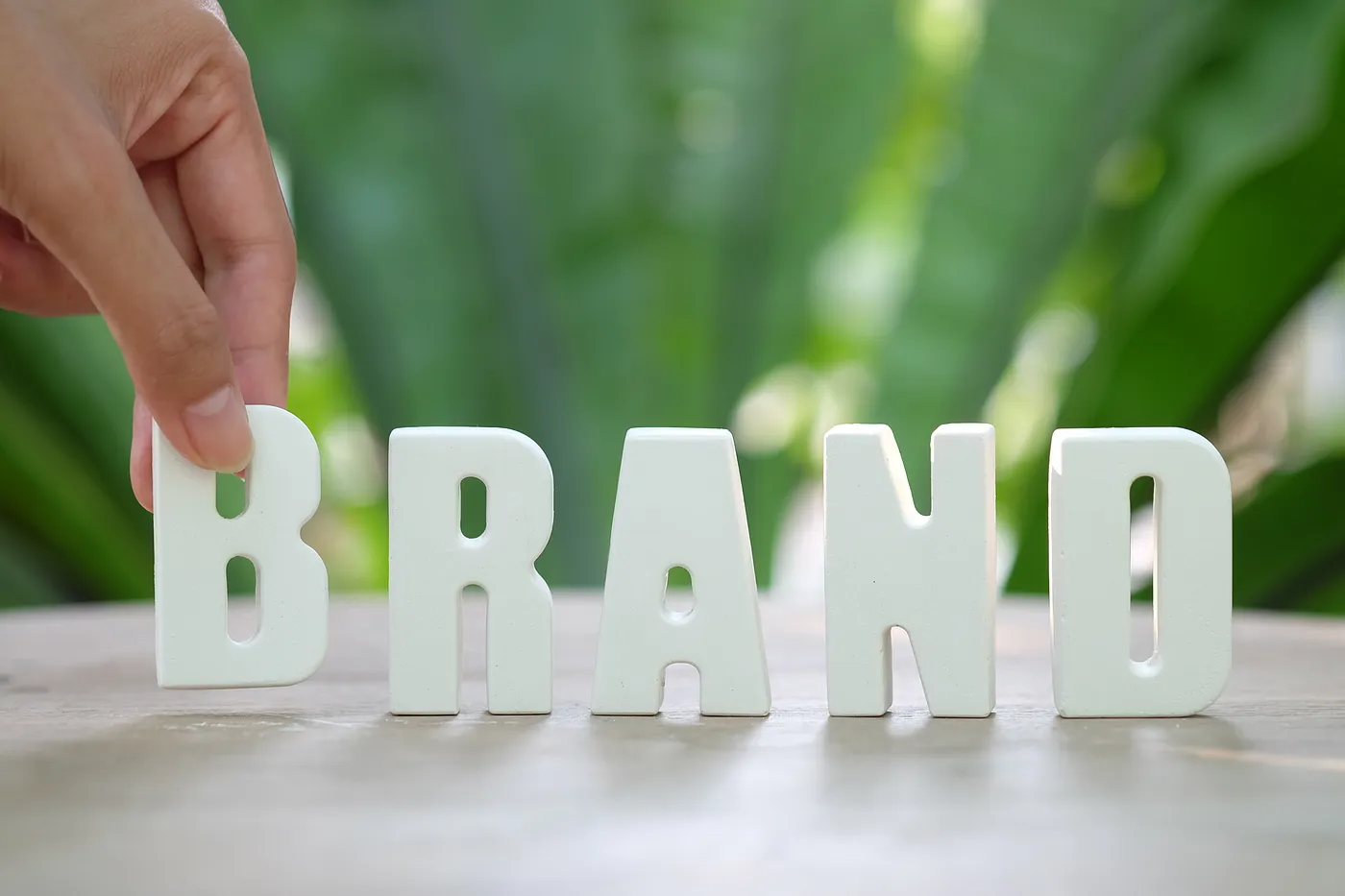 someone-stacking-the-letters-of-brand